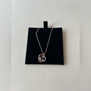 It is a delicate rose-gold-colored necklace with a fine 925 silver chain.